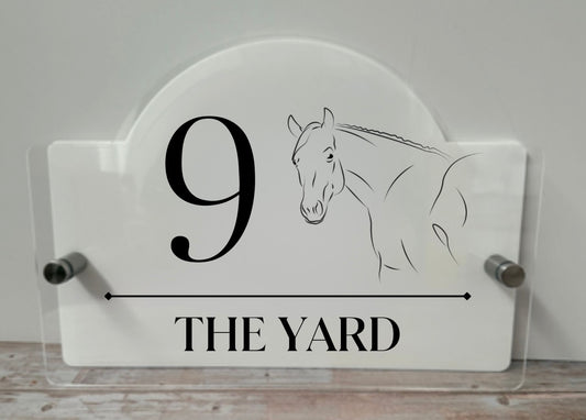 Acrylic House name sign with stainless steel standoffs.