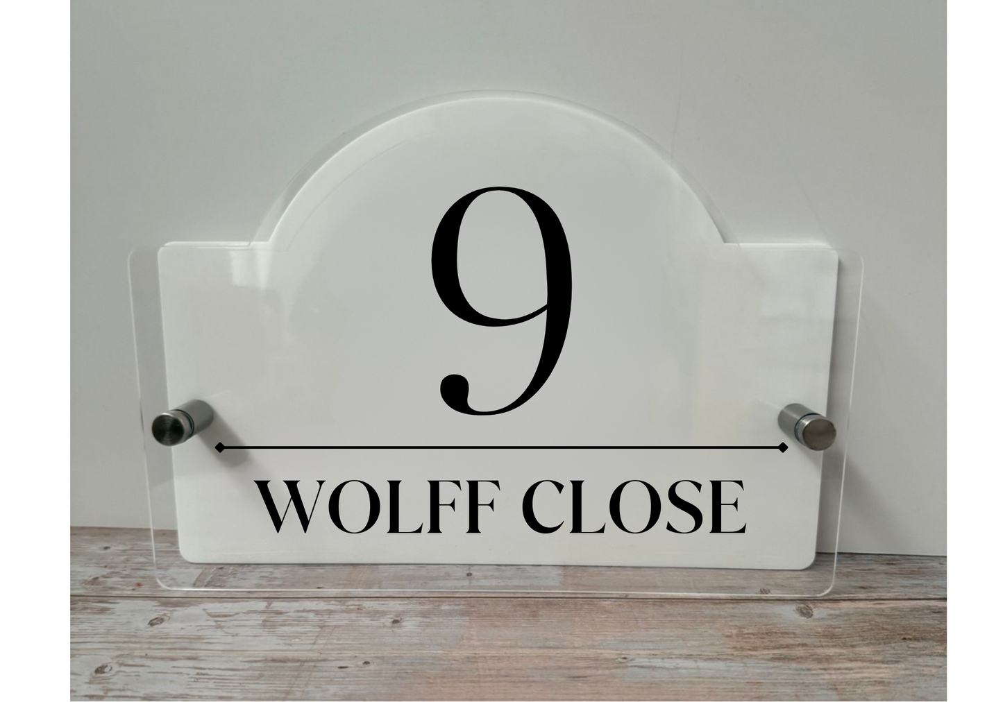 Acrylic House name sign with stainless steel standoffs.