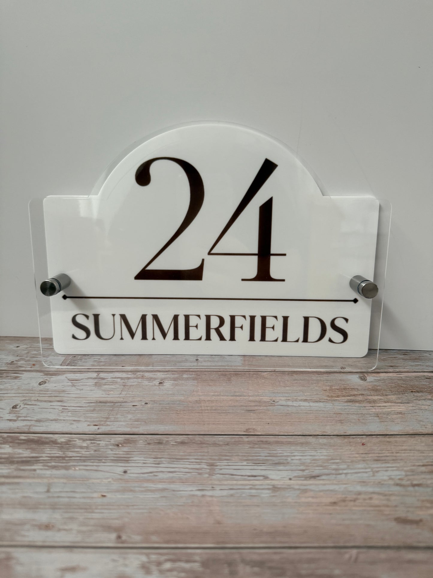Acrylic House name sign with stainless steel standoffs.