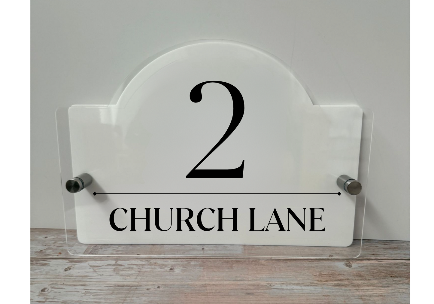 Acrylic House name sign with stainless steel standoffs.