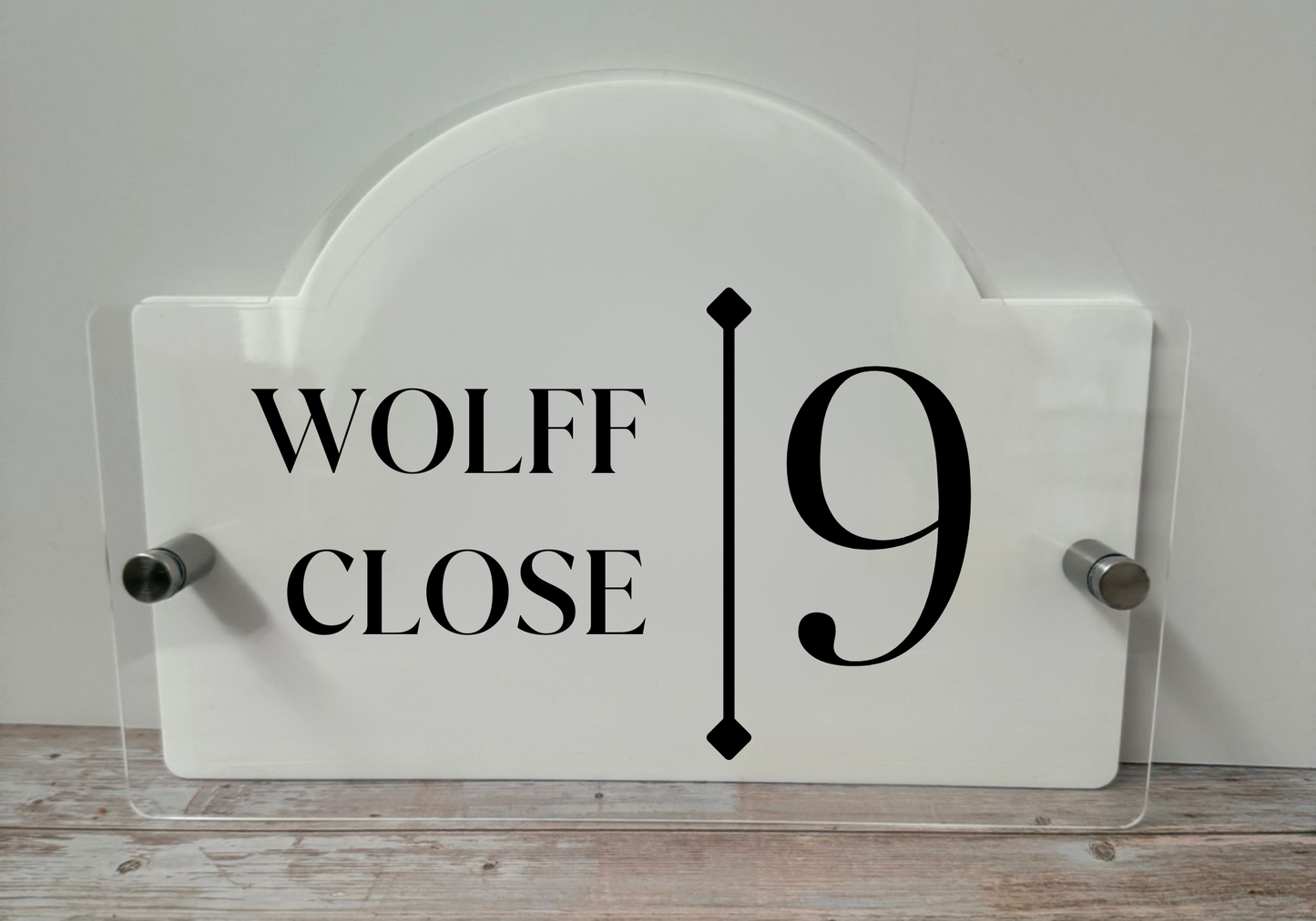 Acrylic House name sign with stainless steel standoffs.